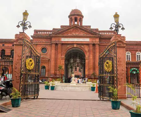 The red-brick gateway of the Partition Museum behind ornate iron gates