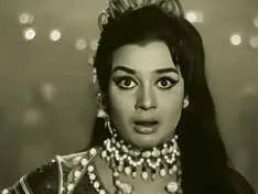 A black-and-white film still of a woman in a jewelled necklace