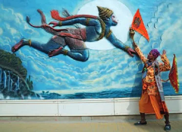 A mural of a flying figure over the river