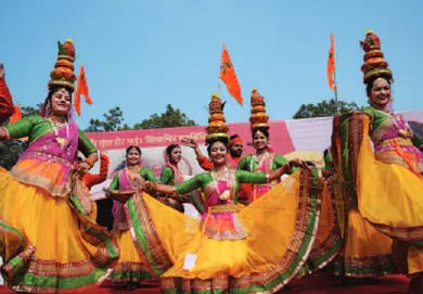Performers in colourful costumes at a festival