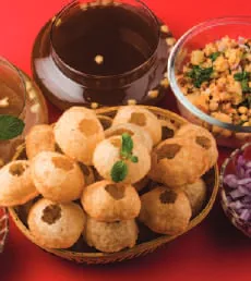 Pani puri and chutneys on a plate