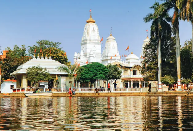 A white temple beside a lake