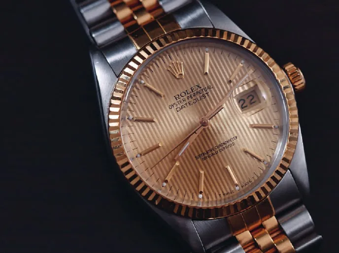 A two-tone gold and steel wristwatch