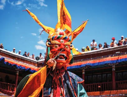A masked dancer at a Losar celebration