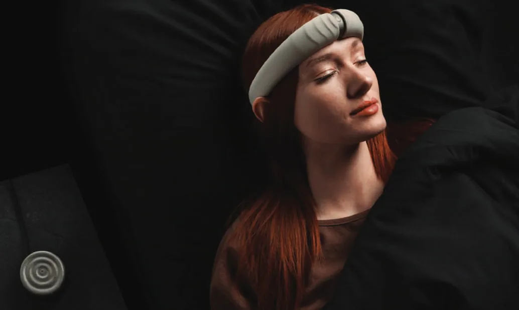 A woman sleeping with a headband on