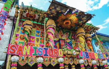 A house decorated with colourful produce and rice wafers for a harvest festival