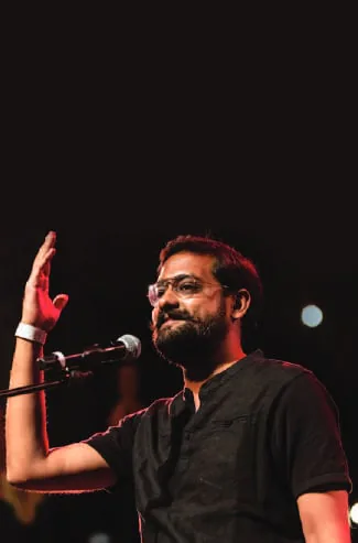 A poet performing at a microphone
