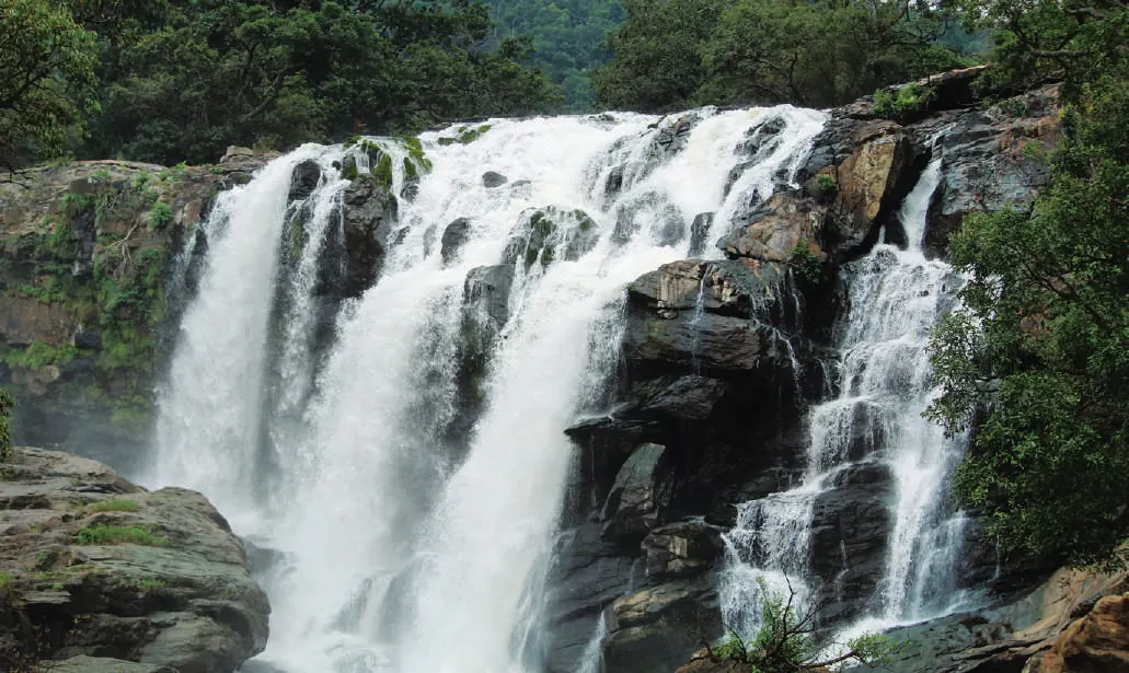 A waterfall cascading over dark rocks