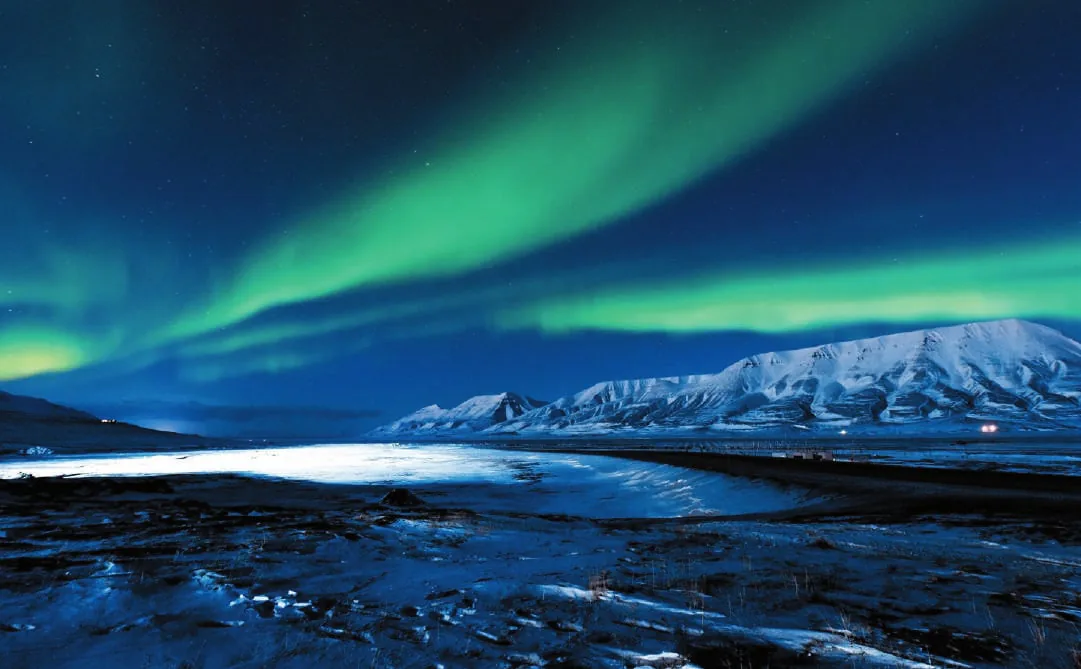 The northern lights over a dark sea