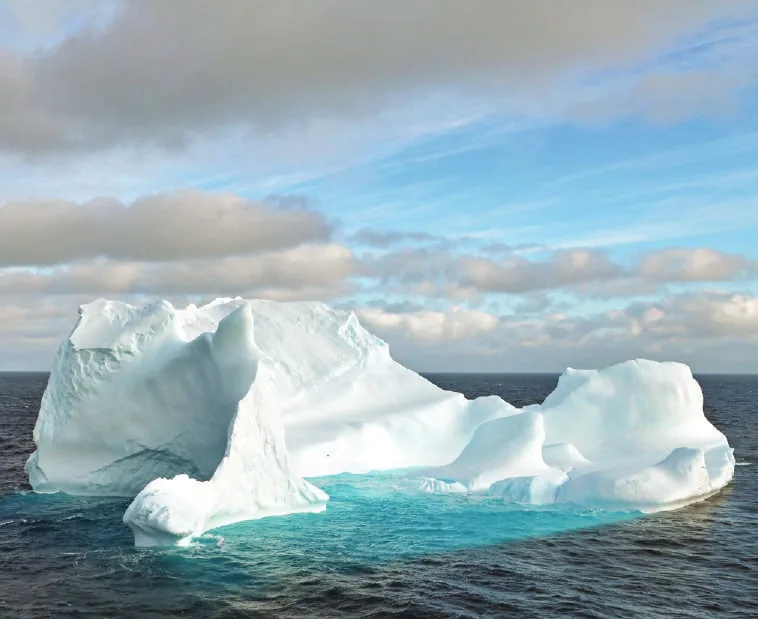A single iceberg floating in the sea