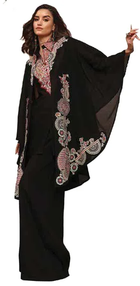 A model in a black kaftan with pink embroidery