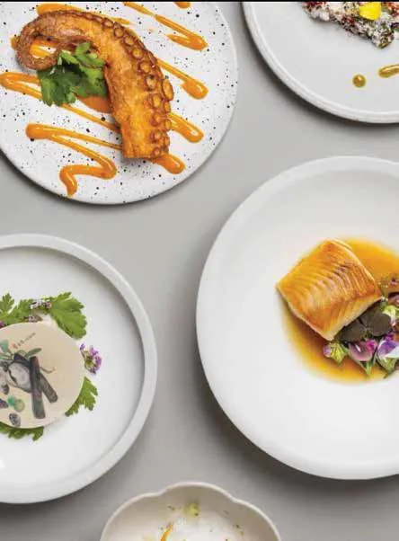 Several plated restaurant dishes seen from above