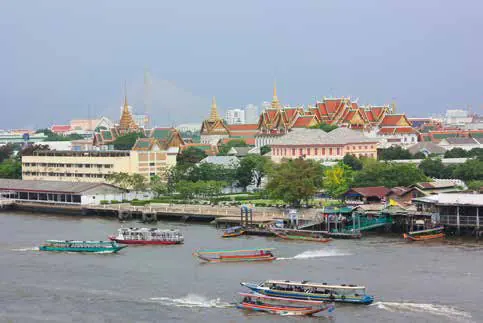 Temples and boats along the Chao Phraya river