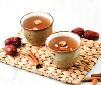 Cups of Korean tea with dates