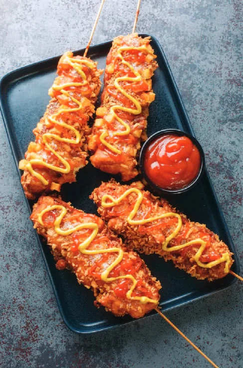 Corn dogs on a plate