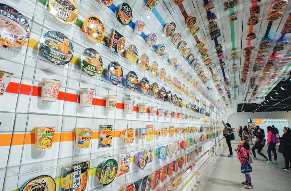 A wall displaying hundreds of instant noodle cups