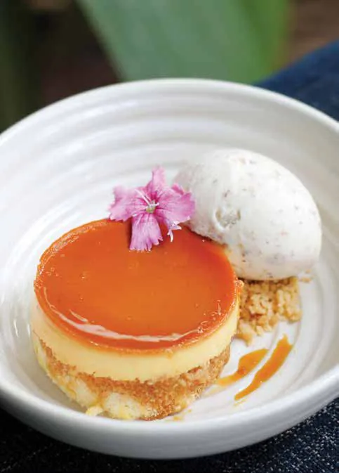A caramel pudding cake topped with a flower