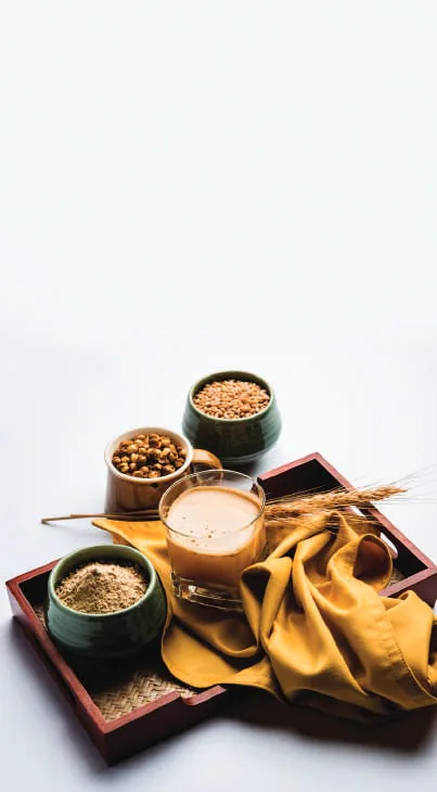 Bowls of sattu and spices on a wooden tray