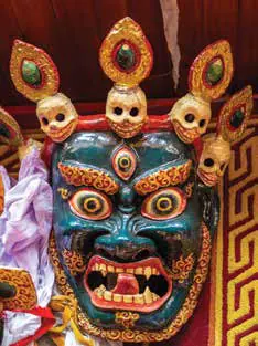 A decorated ritual mask featuring skulls