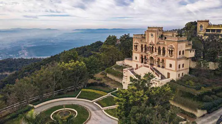 A palace-like resort on a hilltop with terraced gardens