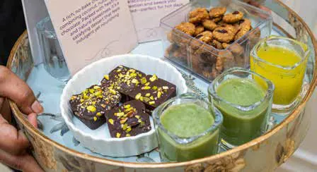 A tray of healthy snacks and fresh juices