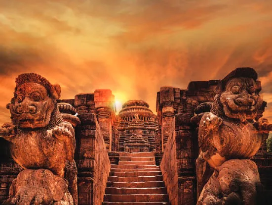 Carved stone figures at a sun temple under a fiery sky