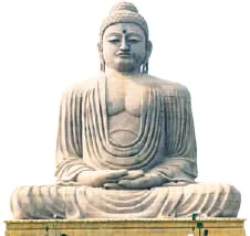 A large white statue of the seated Buddha