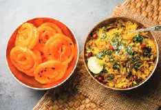 Bowls of jalebi and poha