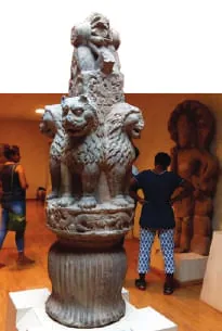 A carved stone lion capital in a museum