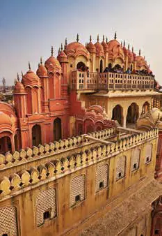 The honeycombed pink facade of a palace