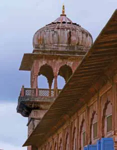 A red sandstone tower topped with a domed pavilion