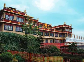 A monastery building below a blue sky