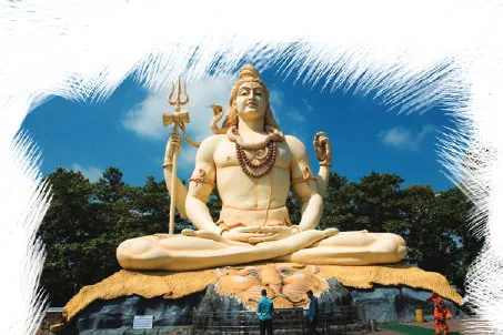 A large white statue of Lord Shiva