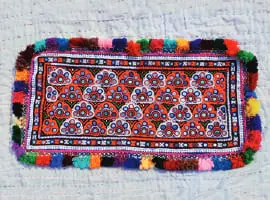 A colourful embroidered textile
