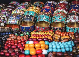 Heaps of colourful beads and jewellery at a market