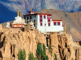 A monastery perched on eroded cliffs