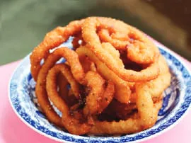 Rings of sel roti on a plate