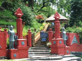 Red-painted gateway and steps up a hillside park