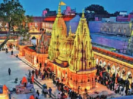 The golden spires of a temple complex by the river