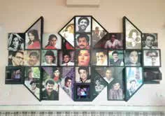 A wall of framed film posters and photographs