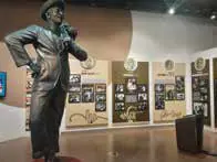 A statue of Raj Kapoor in a museum gallery