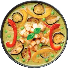 A bowl of Thai curry seen from above
