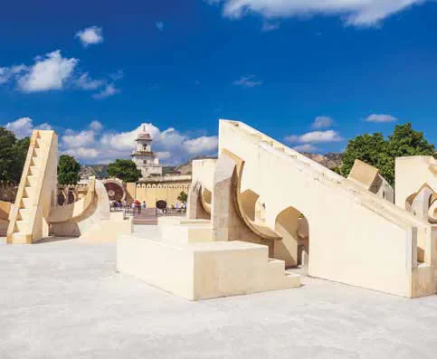 The stone astronomical and astrological instruments of Jantar Mantar observatory under a blue sky