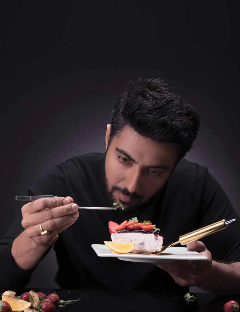 Chef Ranveer Brar holding a plated dessert