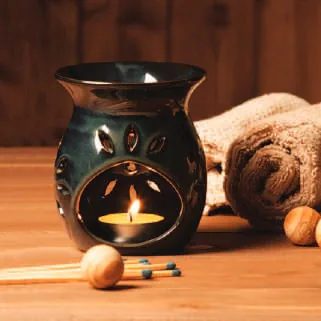 An aromatherapy diffuser with a lit candle