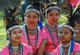 Young women in traditional dress and headgear