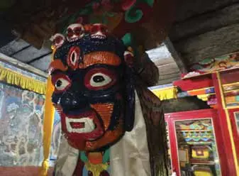 A painted mask at a monastery