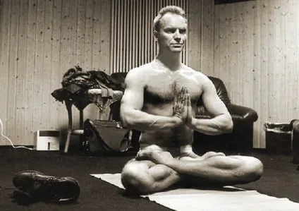 Black-and-white photograph of Sting meditating
