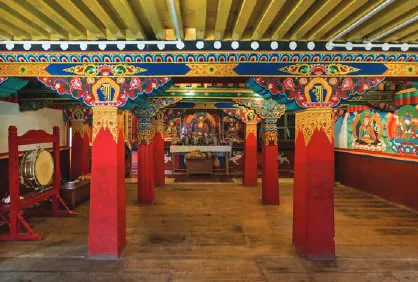 A monastery interior with red pillars