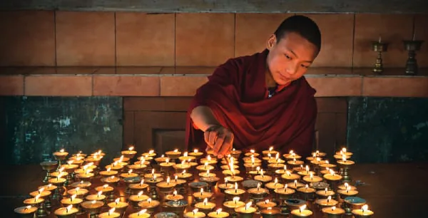 Butter lamps lit in rows